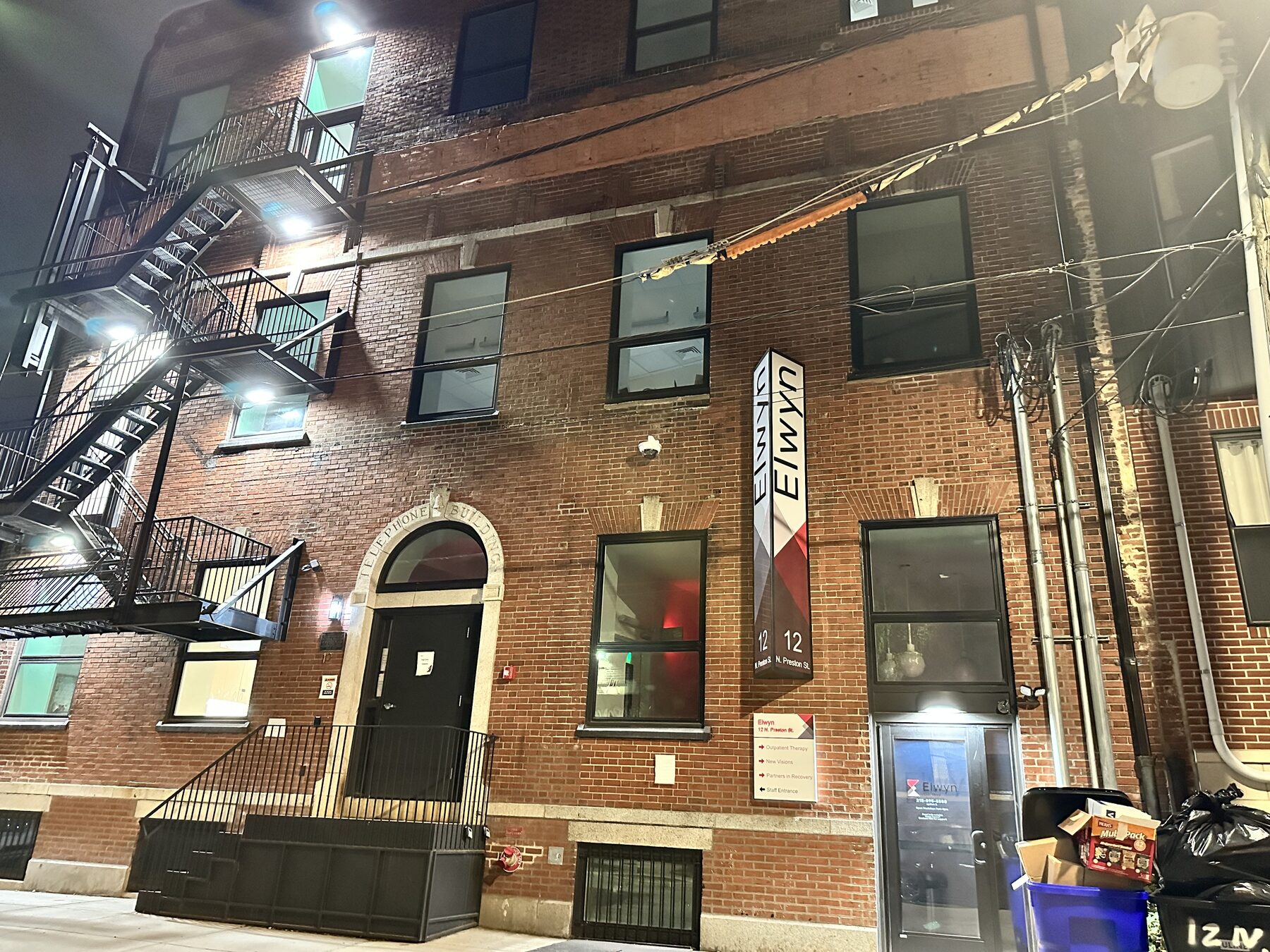Completed illuminated exterior sign at the Philadelphia program facility at night